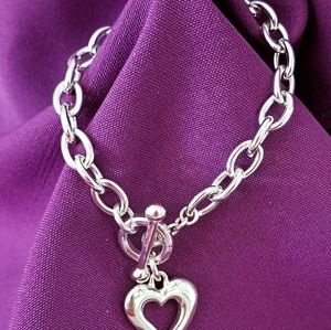 Silver overlay chain bracelet with heart charm.